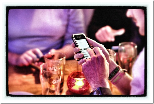 Smartphone at bar by flickr user phil campbell